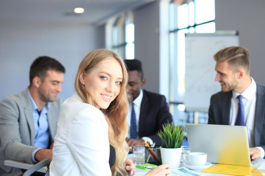 business woman with her staff, people group in background at modern bright office indoors