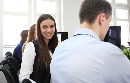 business woman with her staff, people group in background at modern bright office indoors