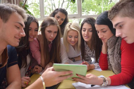 happy young teens group in school on chemisty lessons and library education