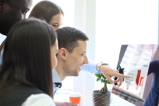 Coworking process, designers team work project. Photo young business crew working with new startup modern office