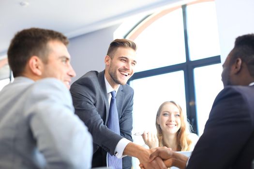 Business people shaking hands, finishing up a meeting