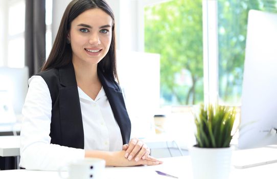 Modern business woman in the office with copy space.