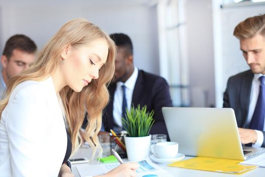business woman with her staff, people group in background at modern bright office indoors