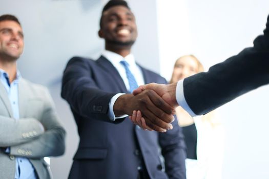 Business people shaking hands, finishing up a meeting
