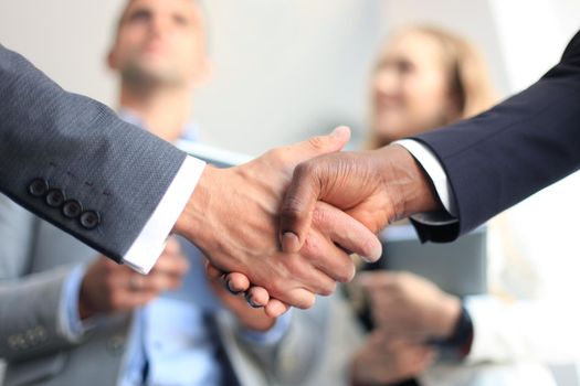 Business people shaking hands, finishing up a meeting