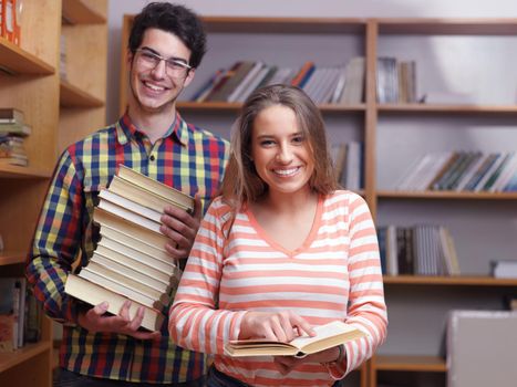 happy young teens group in school on chemisty lessons and library education