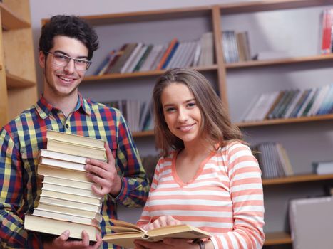 happy young teens group in school on chemisty lessons and library education