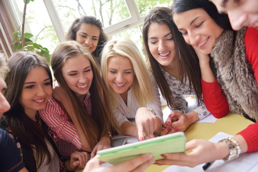 happy young teens group in school on chemisty lessons and library education