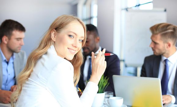 business woman with her staff, people group in background at modern bright office indoors