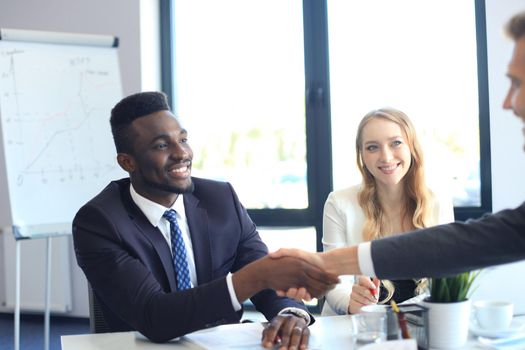 Business people shaking hands, finishing up a meeting