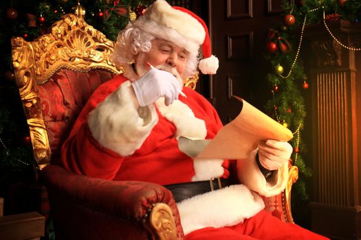 Portrait of Santa Claus answering Christmas letters.