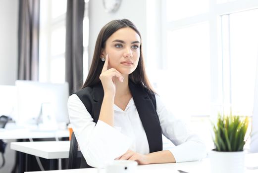 Modern business woman in the office with copy space