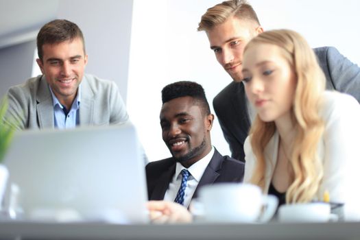 Businessman with colleagues in the background in office