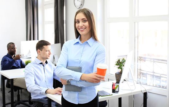 Face of beautiful woman on the background of business people