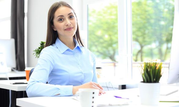 Modern business woman in the office with copy space