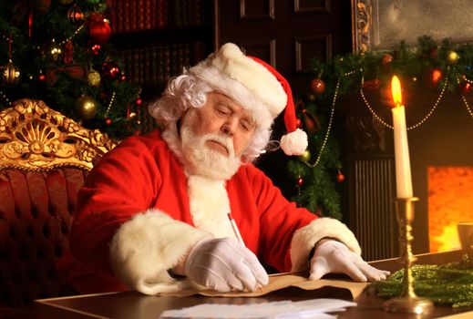 Portrait of Santa Claus answering Christmas letters.