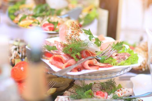 close up.a plate of cold meats on plates in the restaurant