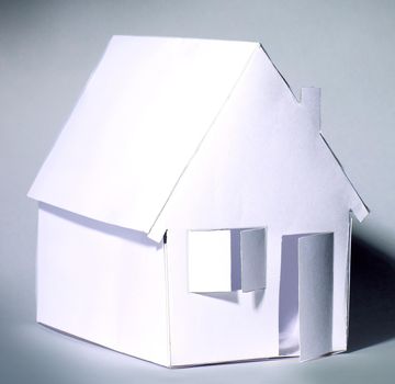 paper house with open door.isolated on grey background.