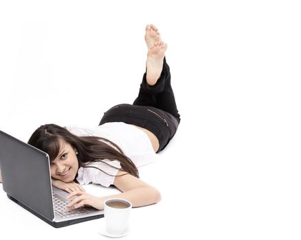 closeup. smiling young woman with laptop in the workplace.isolated on white.