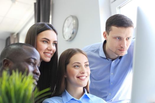 Coworking process, designers team work project. Photo young business crew working with new startup modern office