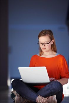 happy student girl working on laptop computer at modern school university indoors