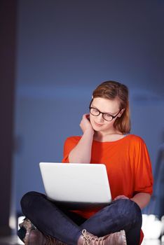 happy student girl working on laptop computer at modern school university indoors