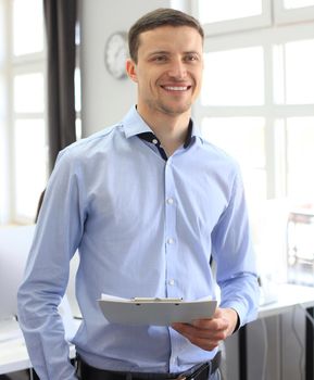 Team leader with coworkers working in office