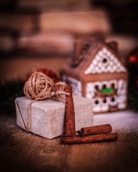 Christmas present on the background of a gingerbread house.photo with copy space