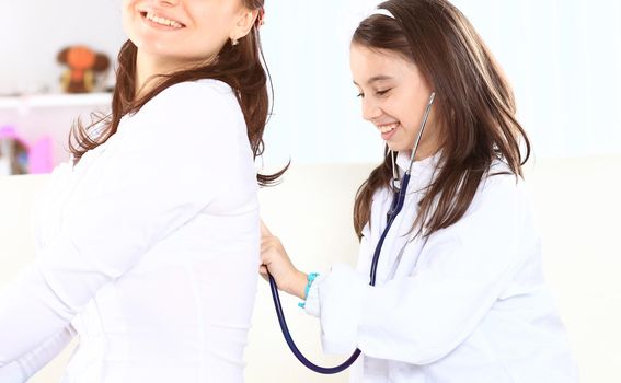 little girl with her mother played doctors.the concept of education