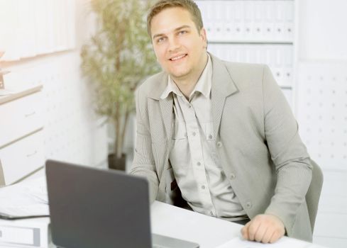 close up. a young businessman sitting at a Desk in the office.