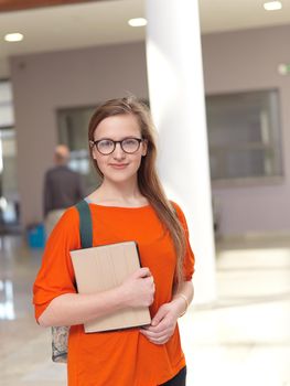 happy student girl working on tablet computer at modern school university indoors