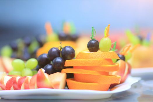 close up.fruit platter and dessert on the table in the restaurant