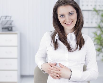 portrait of successful business woman,sitting at her Desk in the office