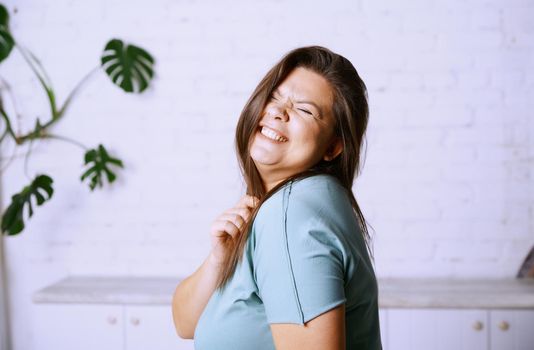 Portrait of the happy plus size model 