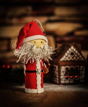 two funny Santa Claus on the background of a gingerbread house..photo with copy space