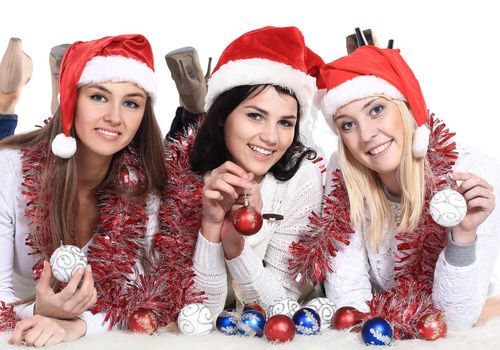 three happy young women in costumes of Santa Claus . the concept of the celebration