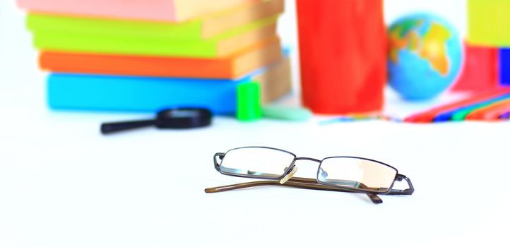 glasses on the background of school supplies.concept of education