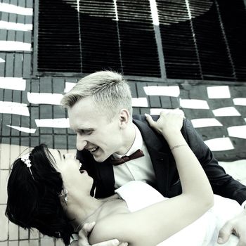 groom hugging his bride on the street.photo with copy space