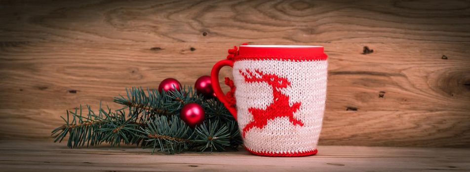 Christmas Cup and fir branch on wooden background.photo with copy space