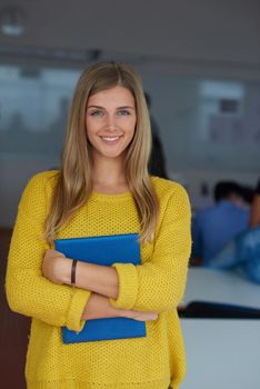 portrait of young female student at school classroom