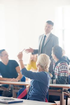 group of students with teacher on class learning lessons