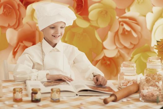 cute little baby is preparing tasty meals the kitchen