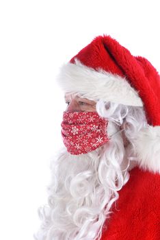 Profile portrait of Santa Claus wearing a homemade COVID-19 mask Mrs. Claus made for him.