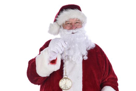 Closeup of Santa Claus holding a large gold pocket watch, isolated on white.