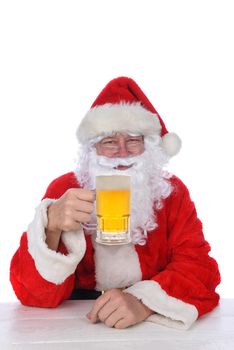 Closeup of Santa Claus holding a mug of beer, isolated on white.