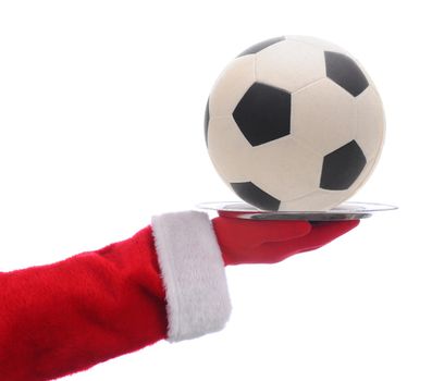 Santa Claus holding a serving tray with a Soccer Ball over a white background.