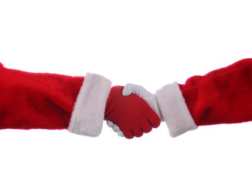 Two Santa Claus' shaking hands over a white background. One Hand is in a red glove the other is wearing a white glove.