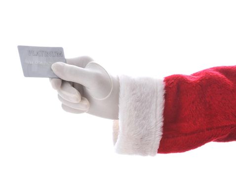 Santa Claus hand holding a platinum credit card isolated over a white background. Great for shopping concept, lay-away, or consumerism