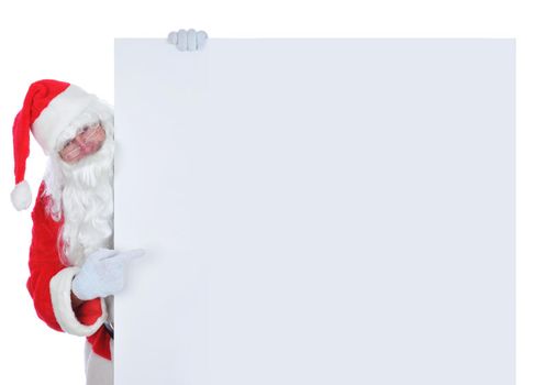 Santa Claus on the side of a wide blank poster pointing at the blank space, isolated on white.