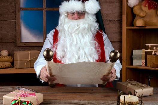 Santa Claus Sitting in His Workshop Reading a scrool with his Naghty and Nice List